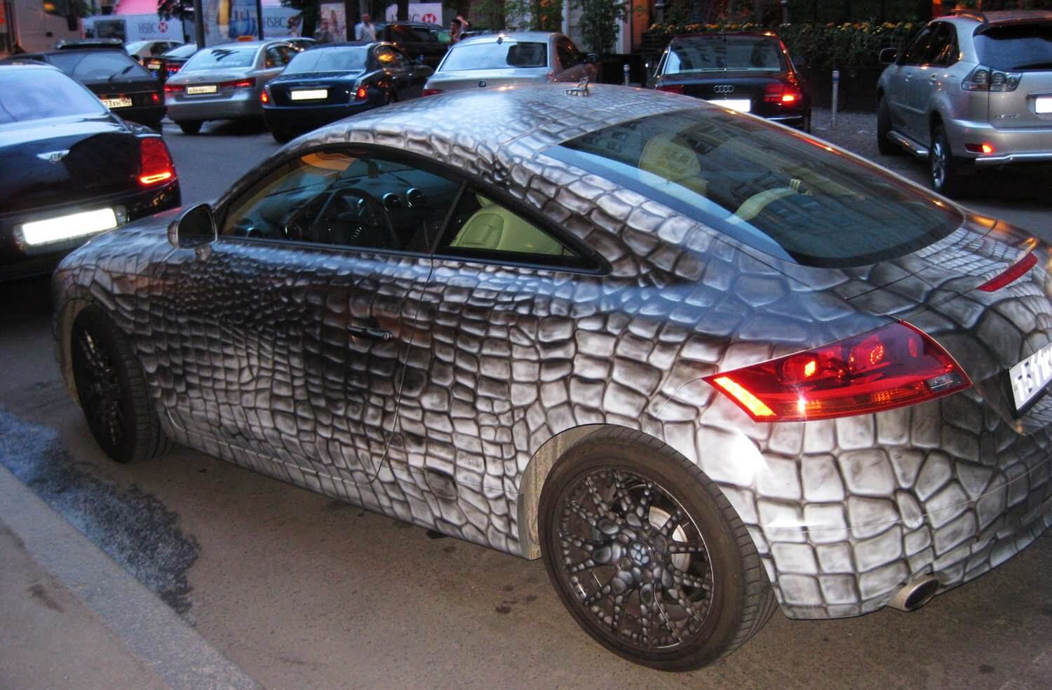 A car that is covered in silver foil
