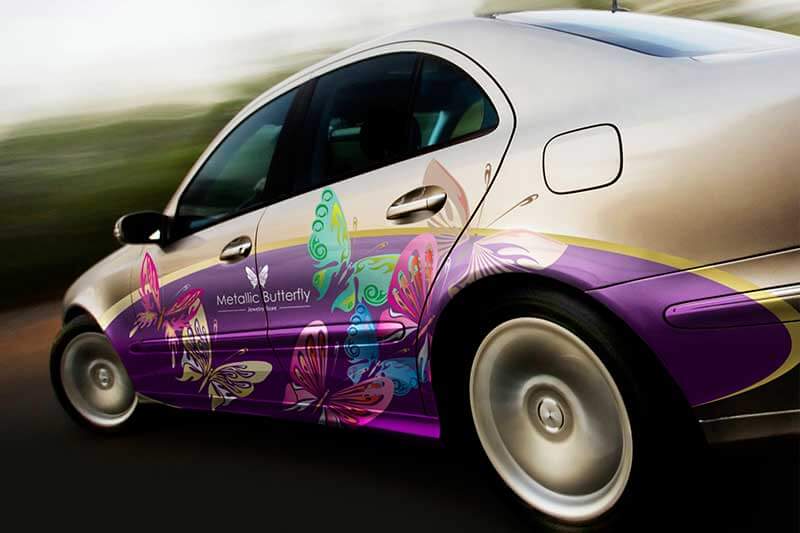A car with a butterfly painted on the side of it
