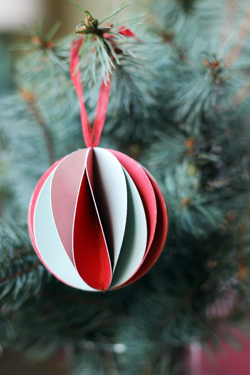 A christmas ornament hanging from a christmas tree
