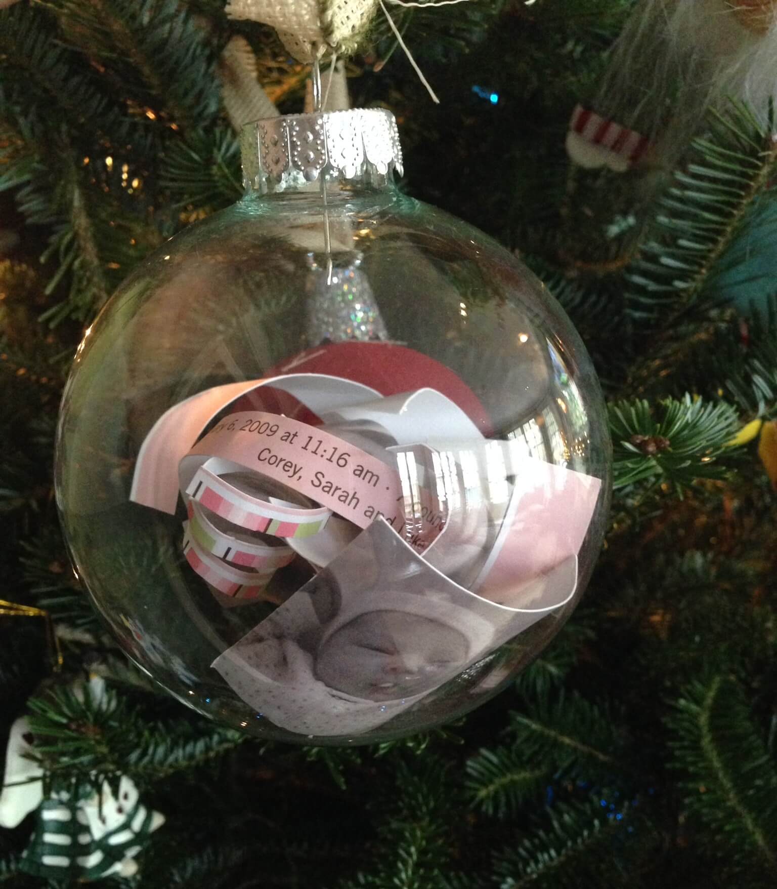 A christmas ornament hanging from a christmas tree
