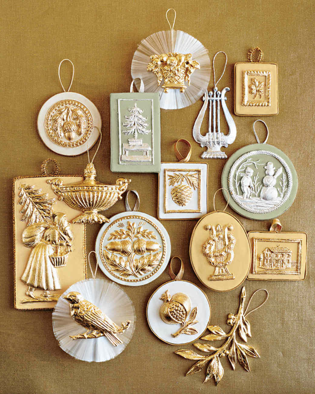 A collection of gold and white christmas ornaments
