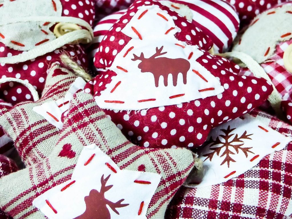 A pile of red and white christmas ornaments
