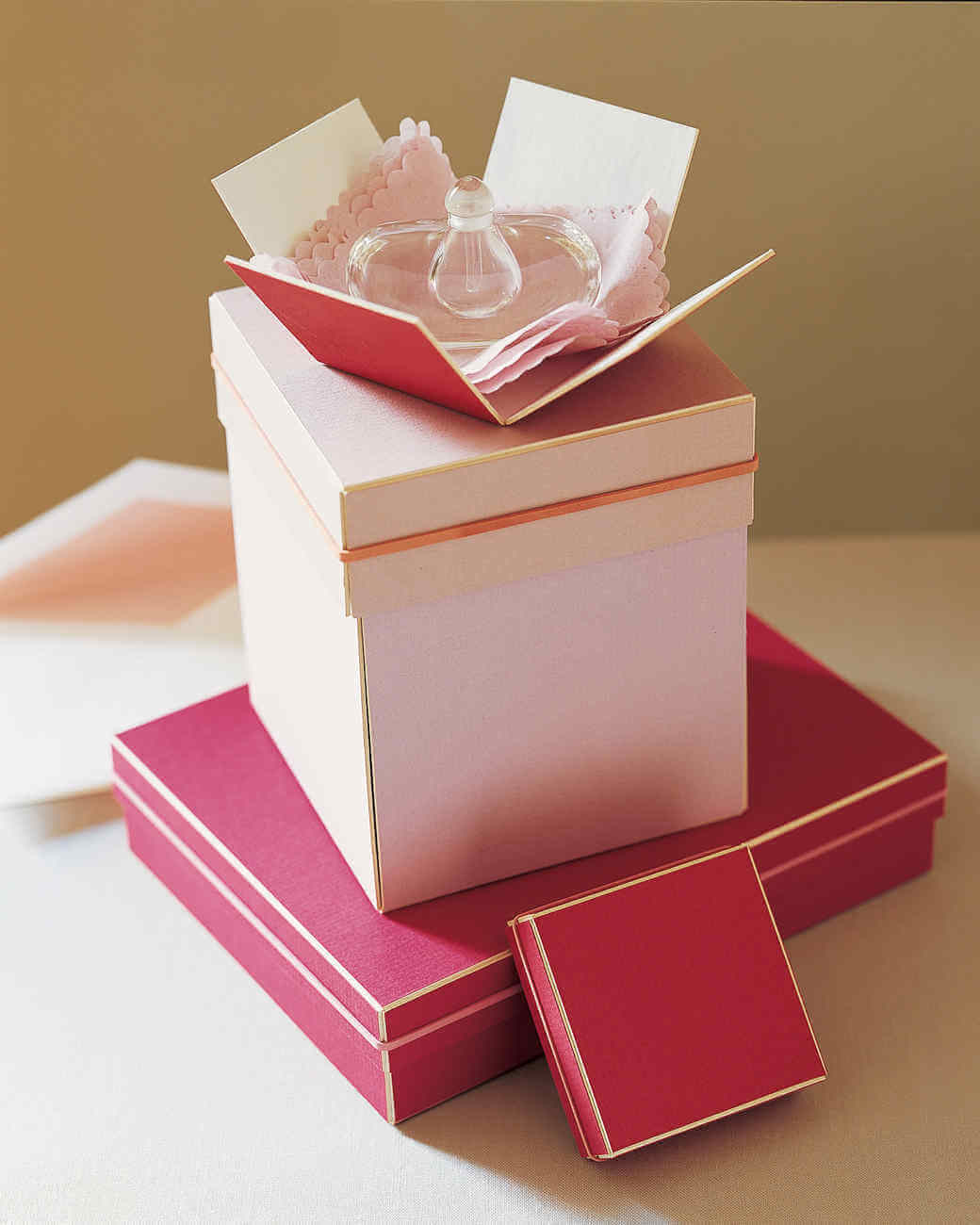 A pink box with a pink lid on top of it
