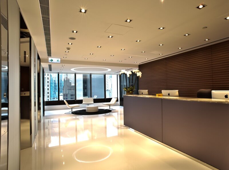 A modern office with a large reception counter
