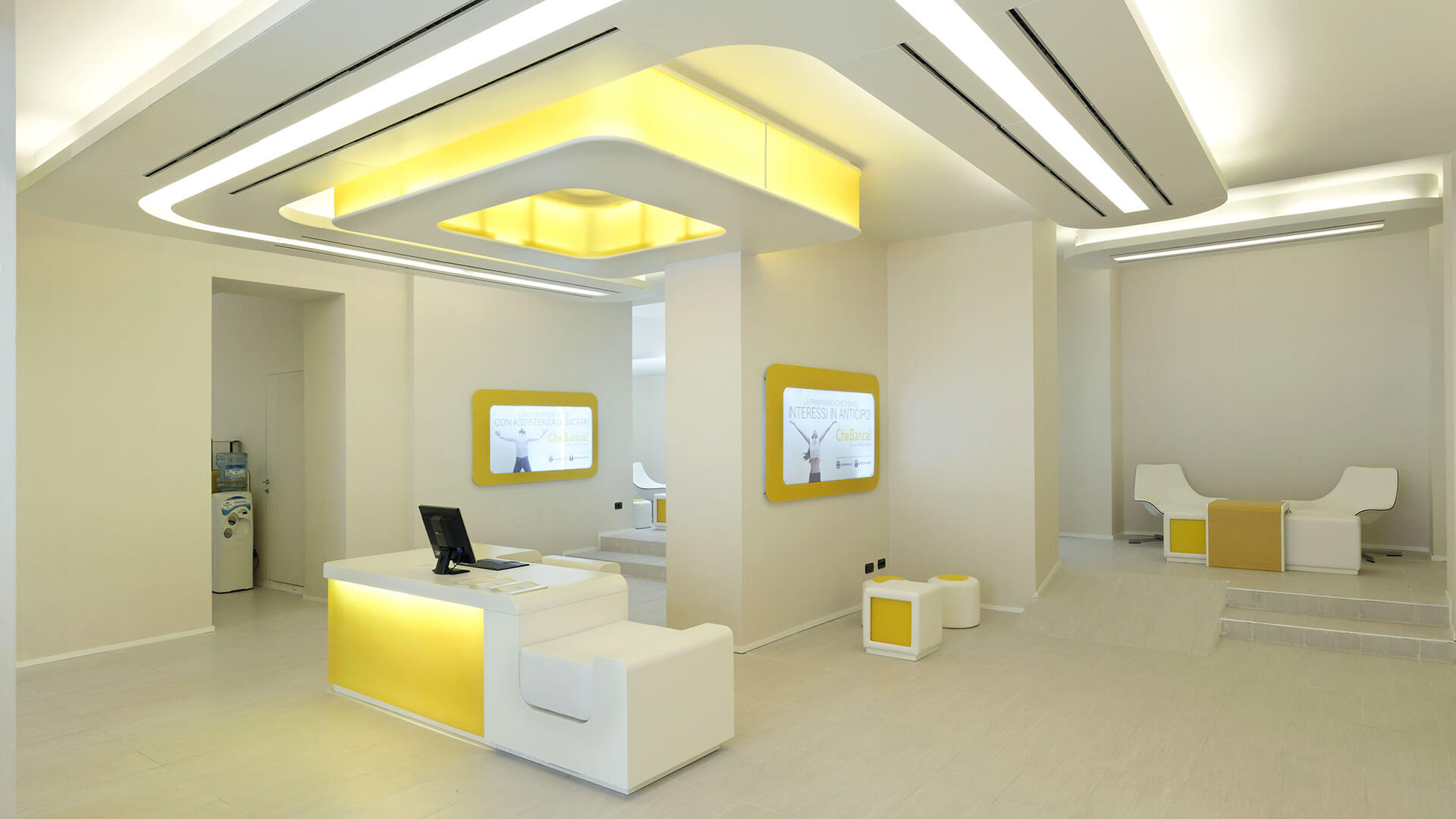 A white room with yellow accents and white furniture

