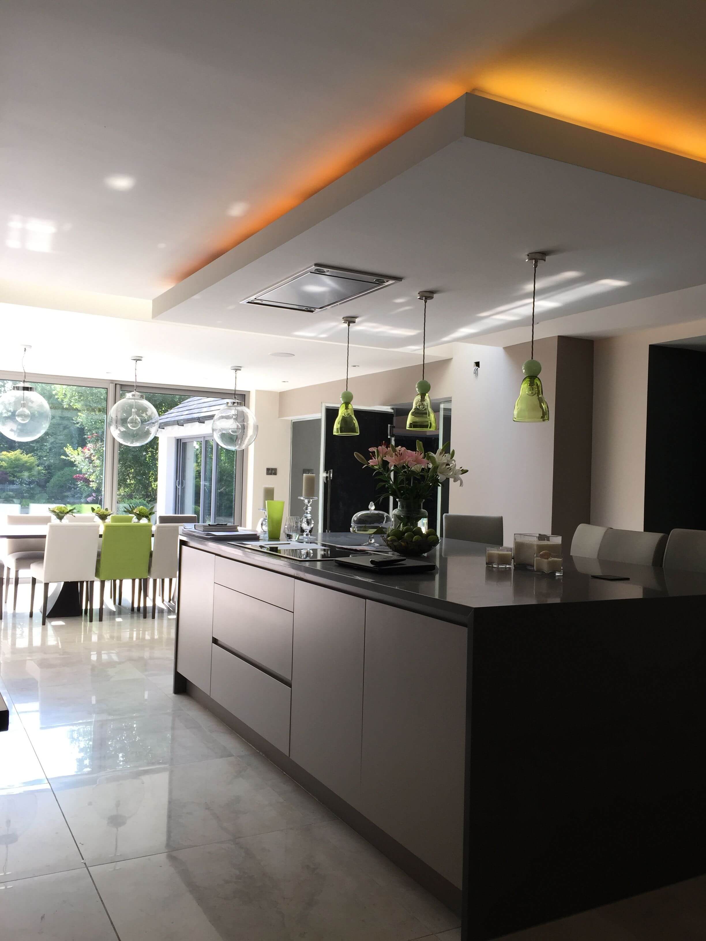 A large kitchen with a center island in the middle of the room
