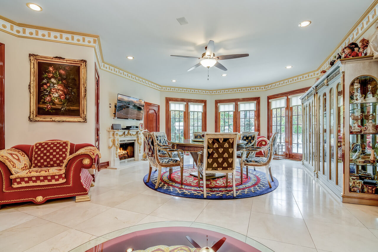 A living room filled with furniture and a ceiling fan
