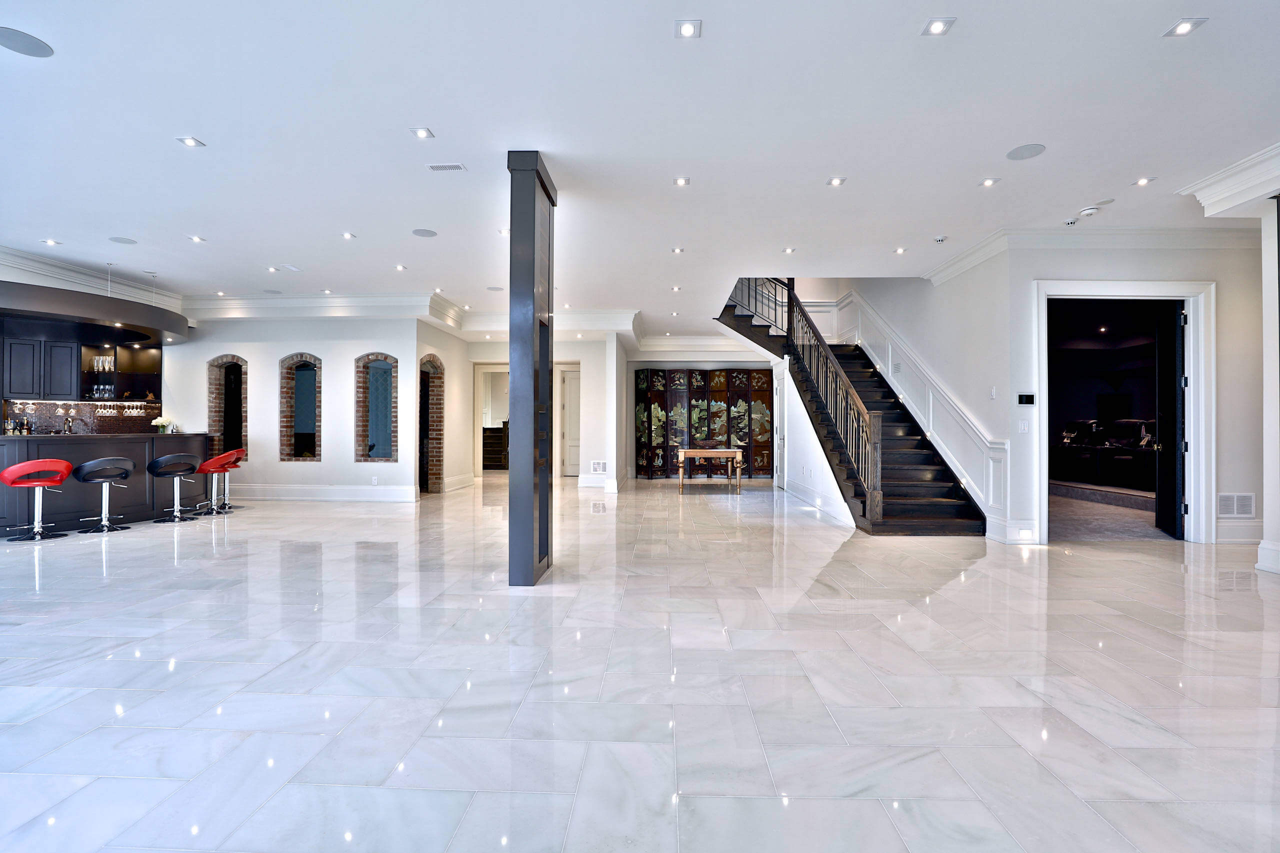 A large open floor plan with a staircase
