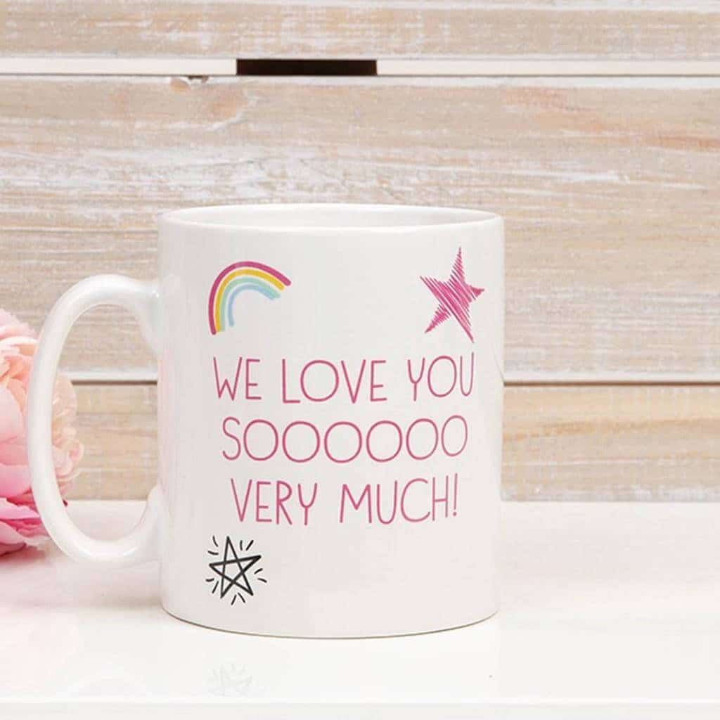 A white coffee mug with the words we love you soooooo very much
