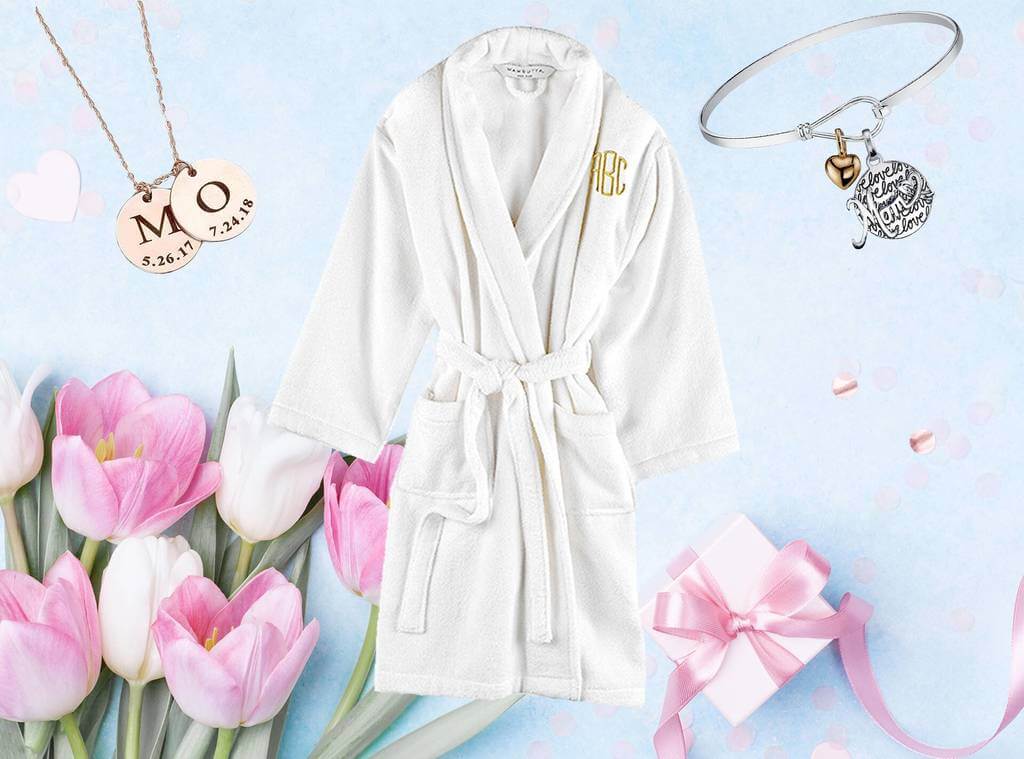 A bathrobe, necklaces, and flowers on a blue background
