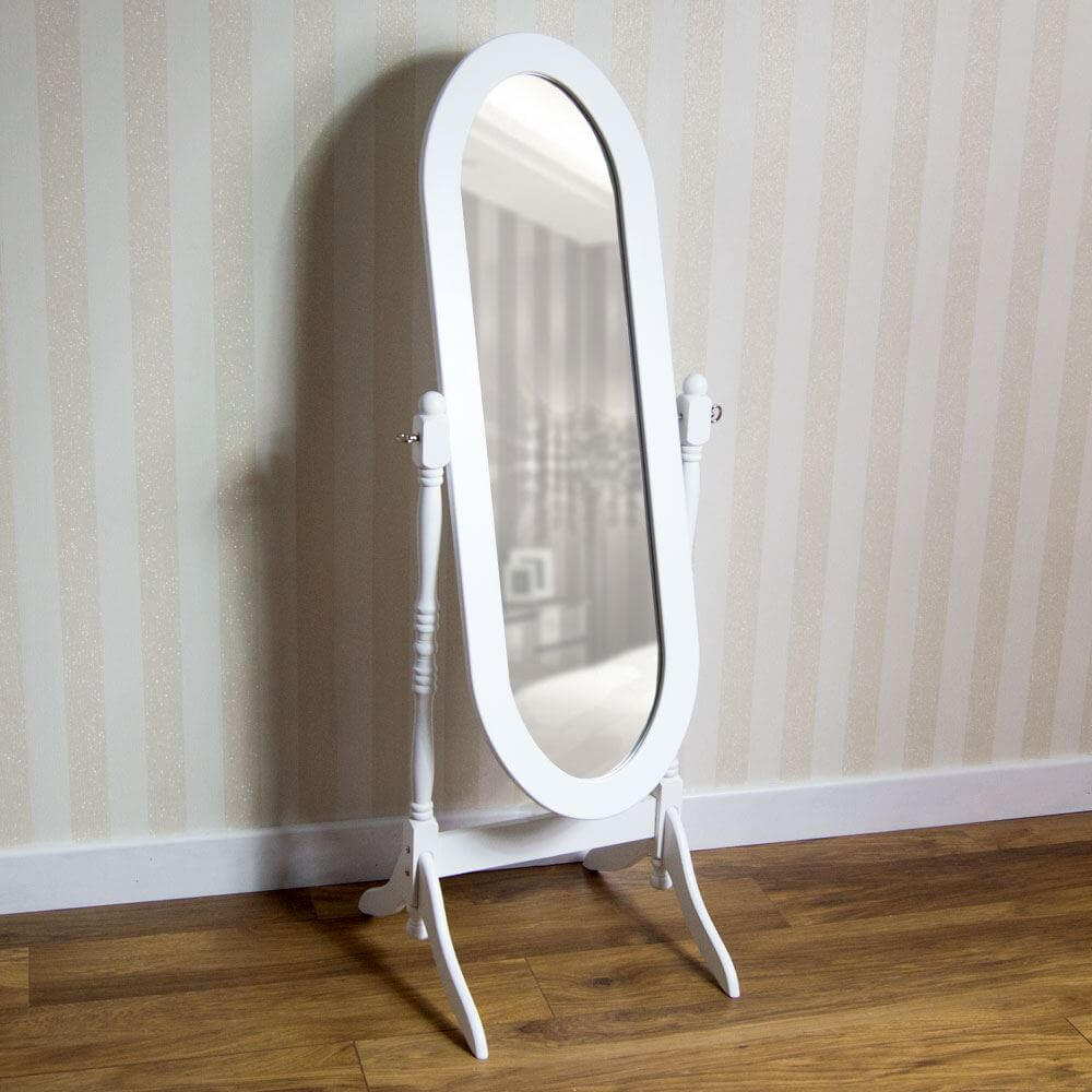 A white vanity mirror sitting on top of a wooden floor

