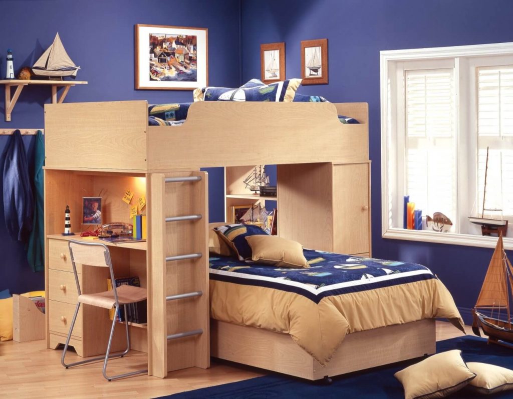 A child's bedroom with a bunk bed and desk
