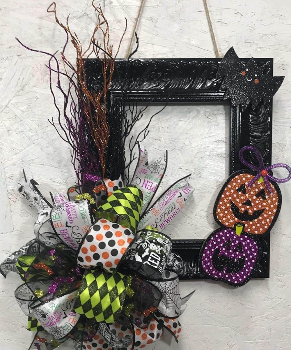 A halloween wreath hanging on a wall
