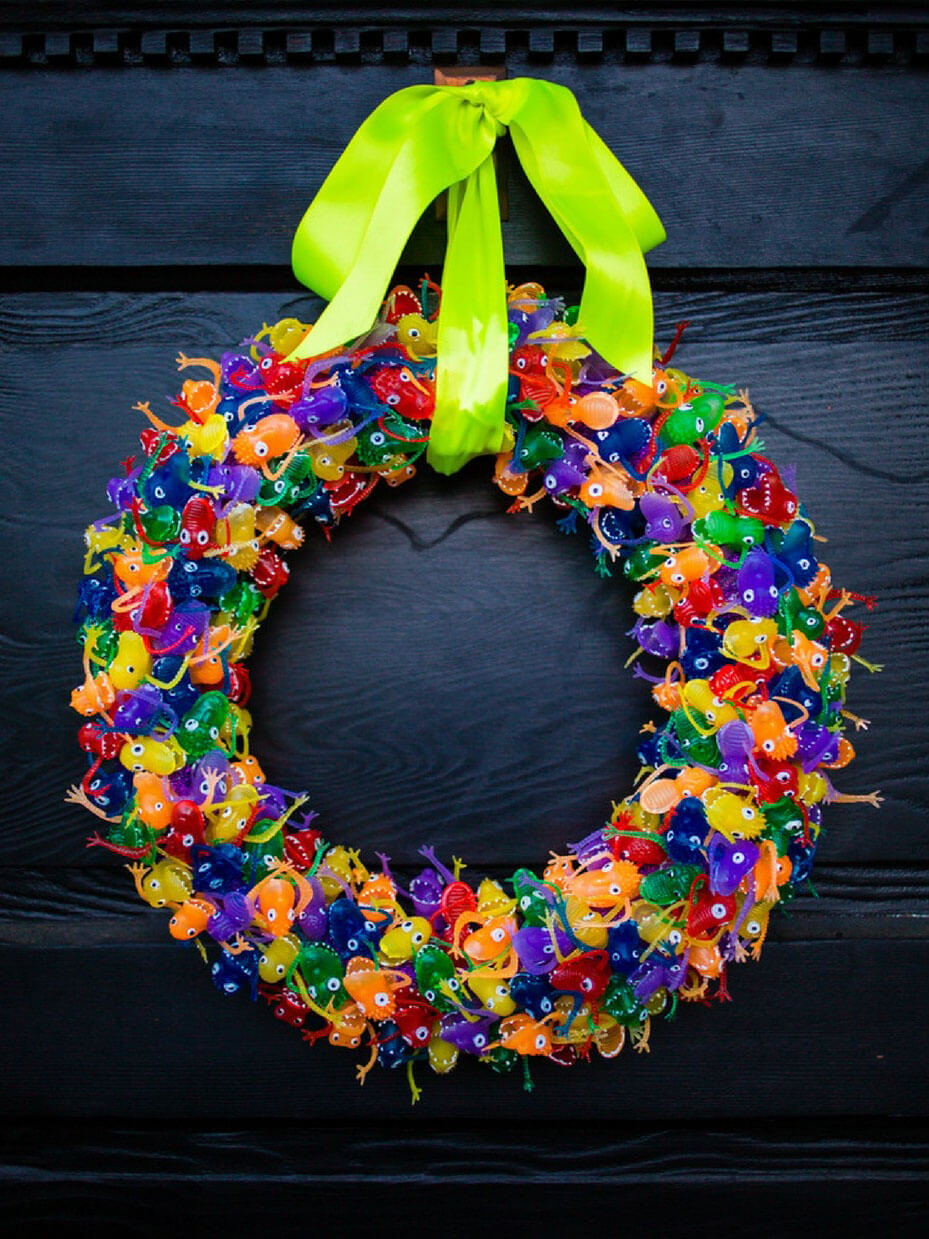 A wreath made of gummy bears with a green bow
