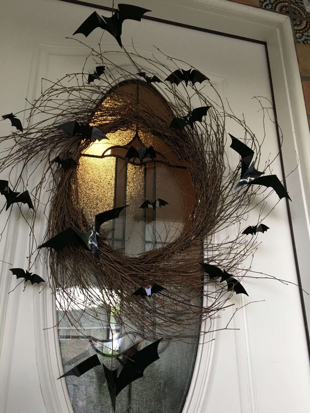 A wreath with bats hanging from it
