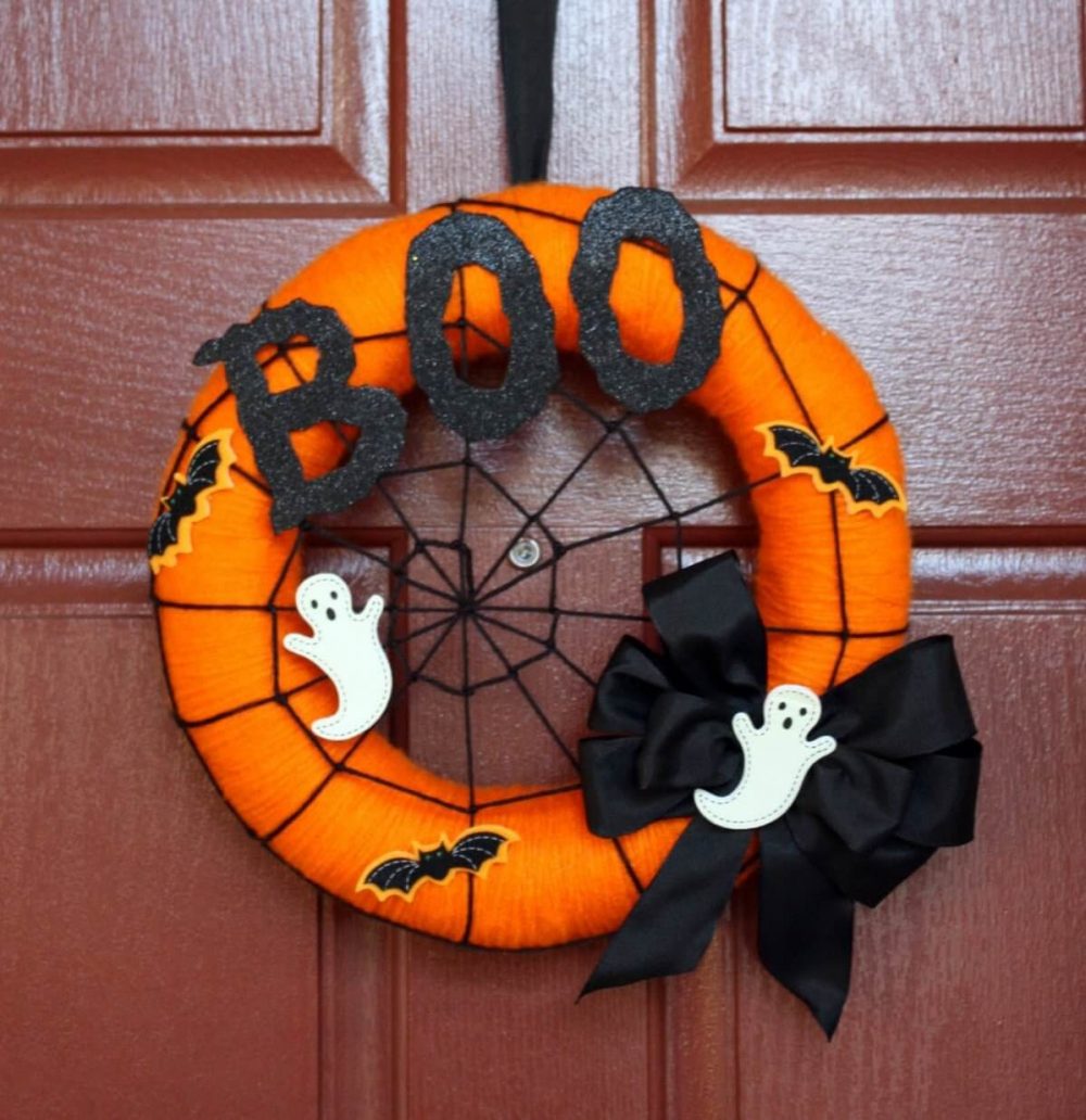 A halloween wreath with a boo on it

