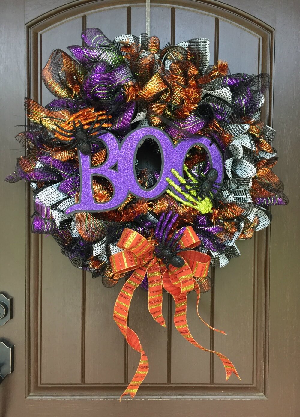 A halloween wreath with the word boo on it
