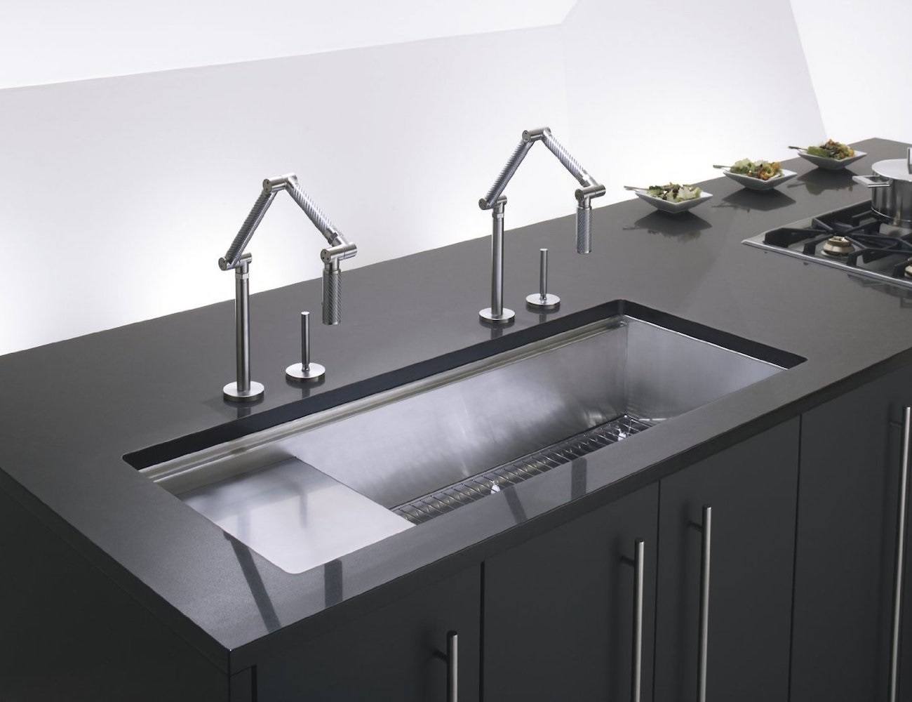 A modern kitchen with a stainless steel sink.