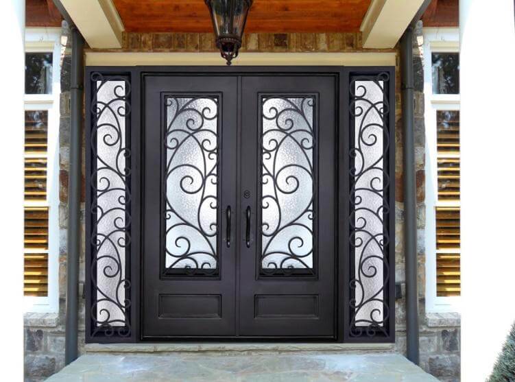 A black double door with glass panels and a light fixture
