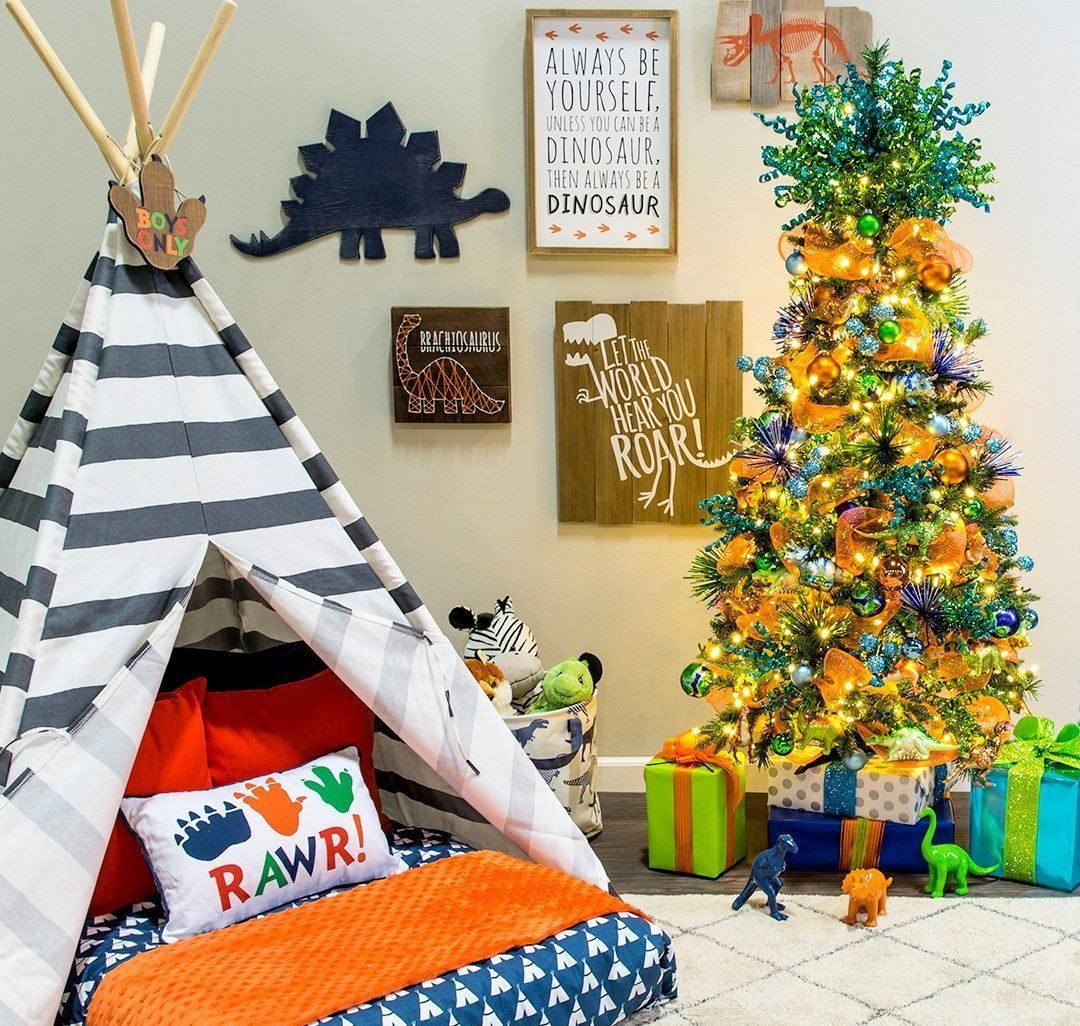 A teepee tent sitting next to a christmas tree
