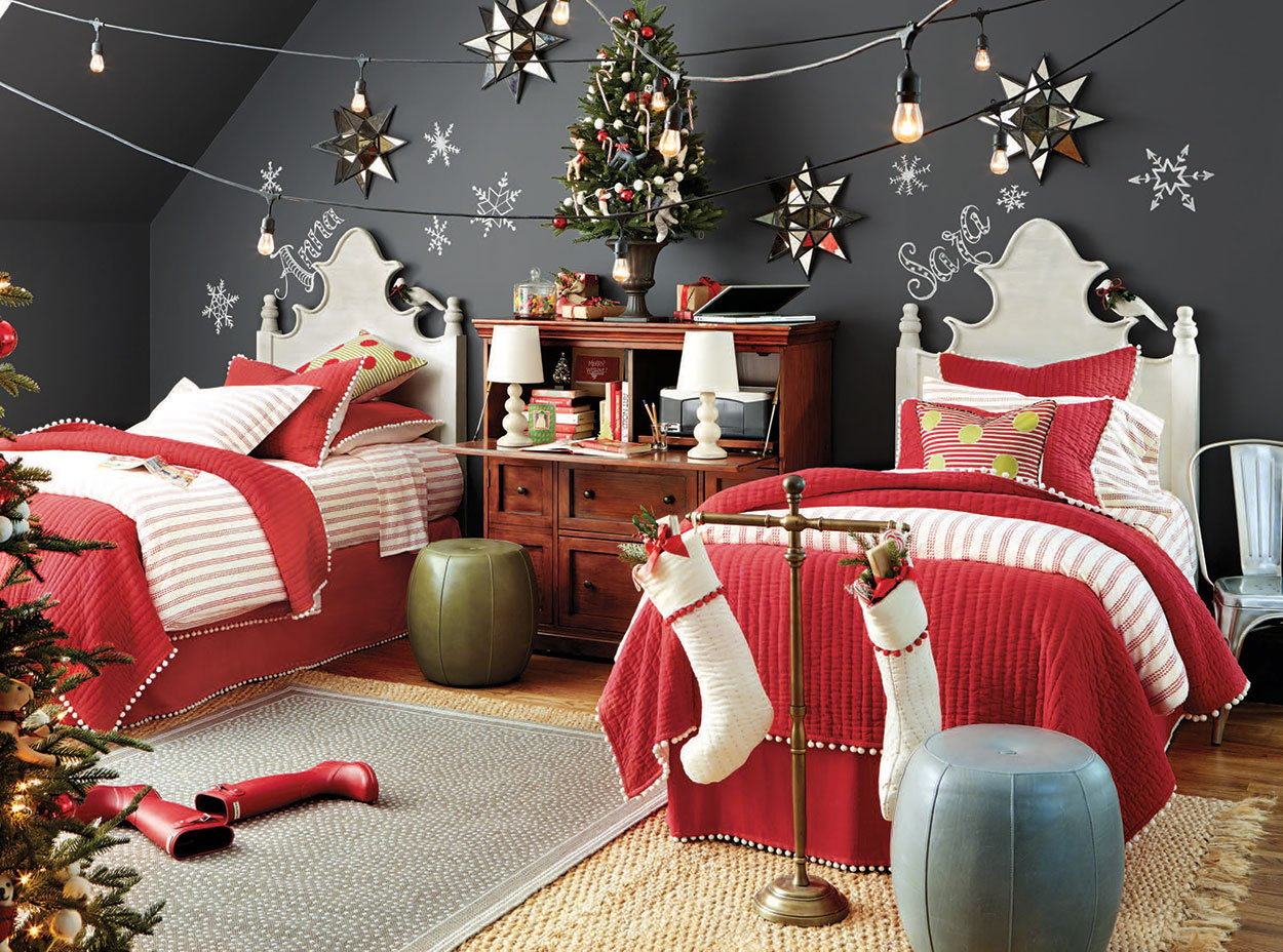 A bedroom decorated for christmas with red and white bedding
