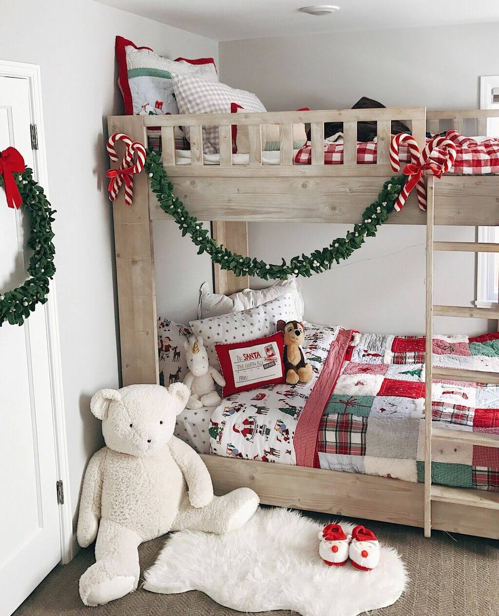 A bedroom with a bunk bed and a teddy bear
