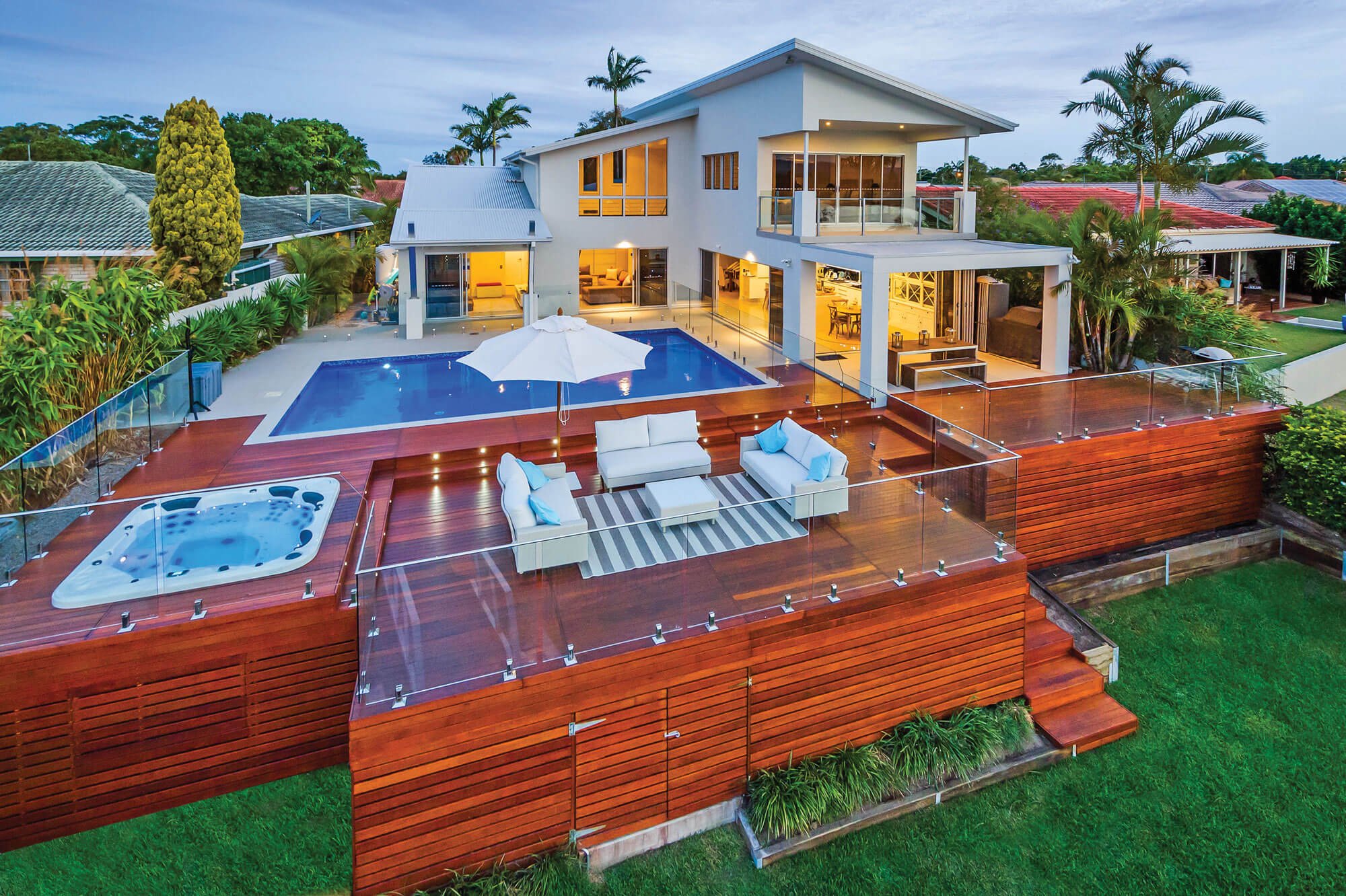 A modern home with a pool and deck.