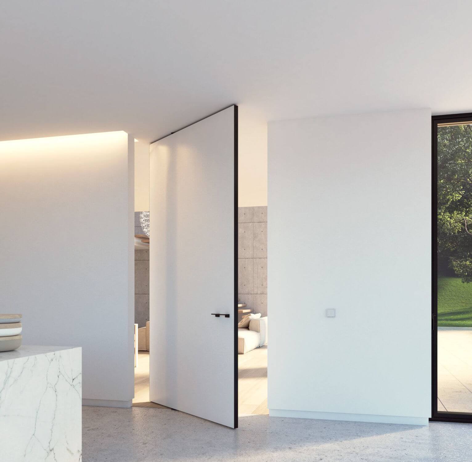 A white room with a marble counter top
and a pivot door