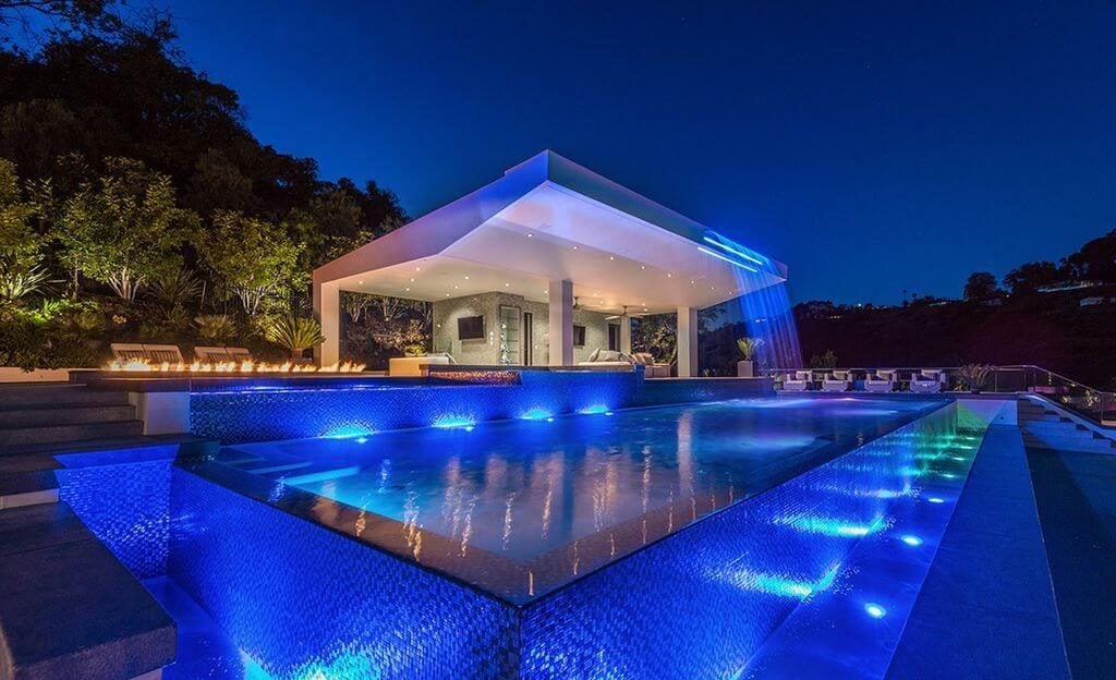 A house with a pool in the middle of it
