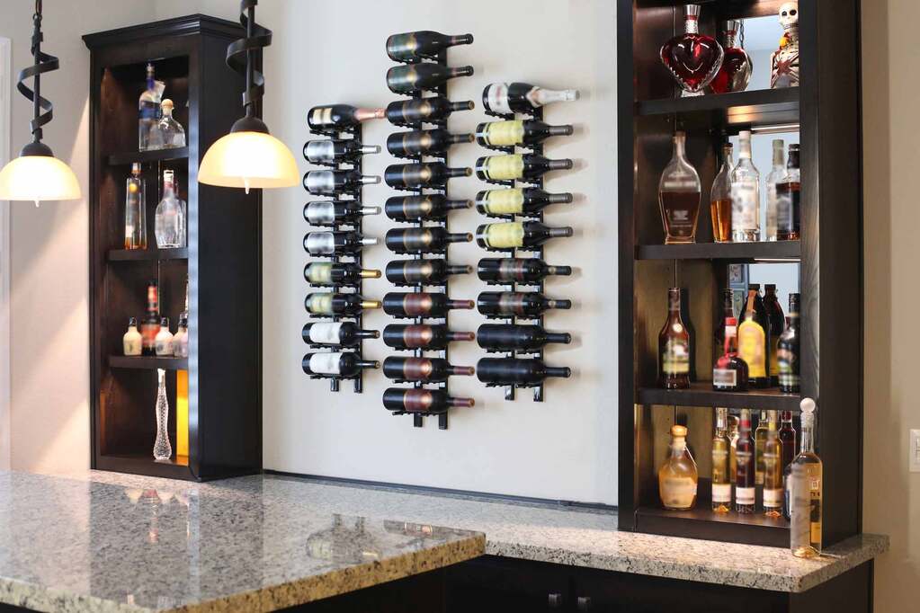 A wine rack with several bottles of wine on it
