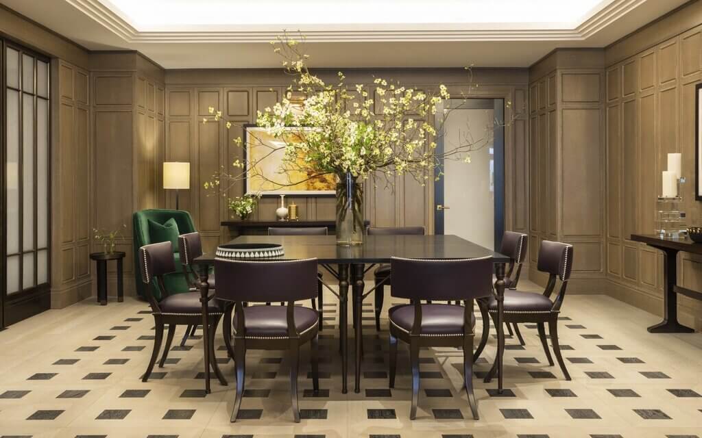A dining room with a table and chairs
