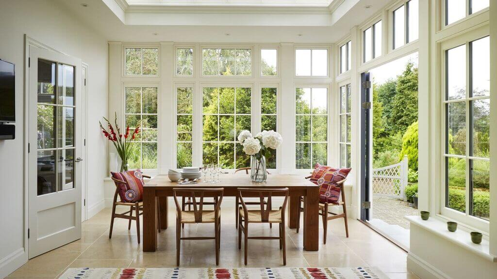A dining room with a table and chairs

