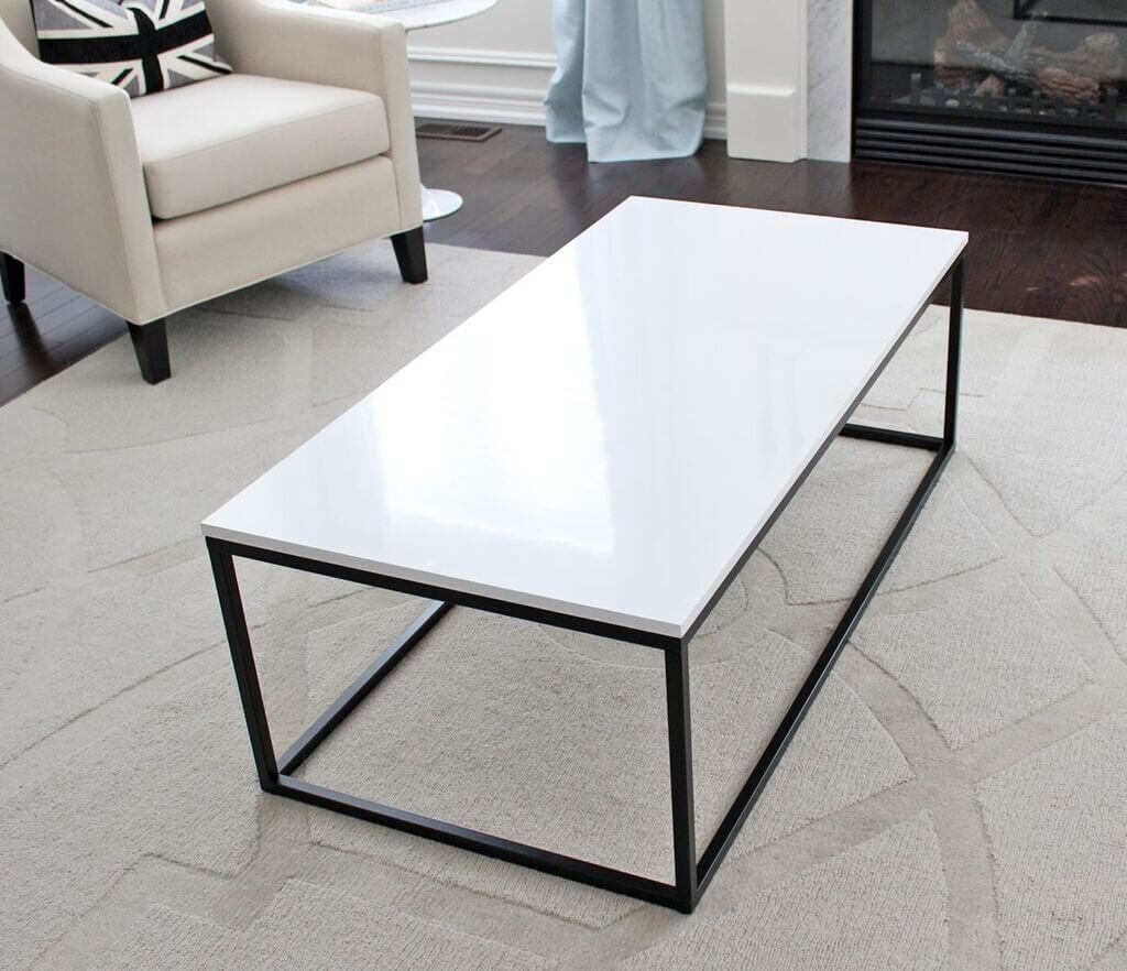 A white coffee table sitting on top of a white rug
