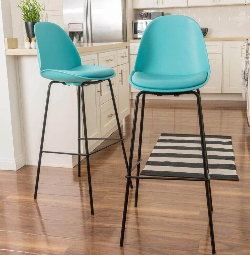 
A pair of blue mid century modern bar stools in a kitchen
