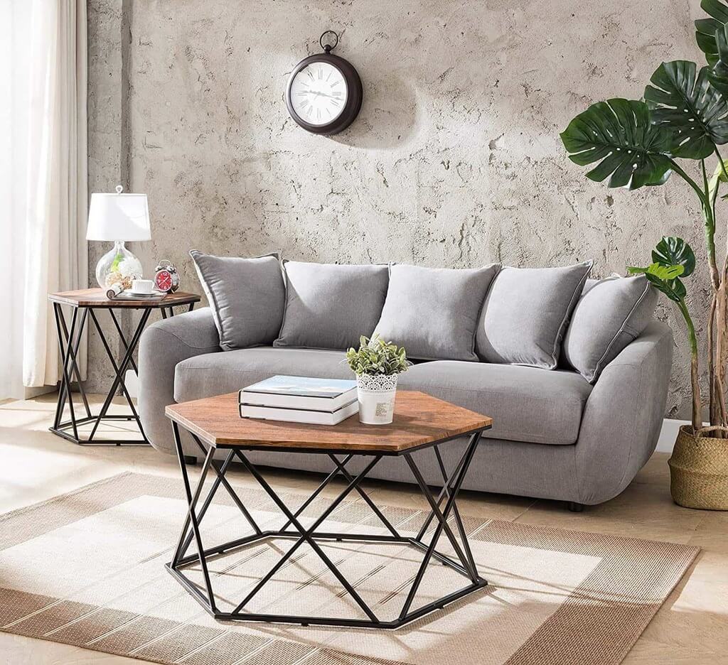 A living room with a gray couch and a coffee table

