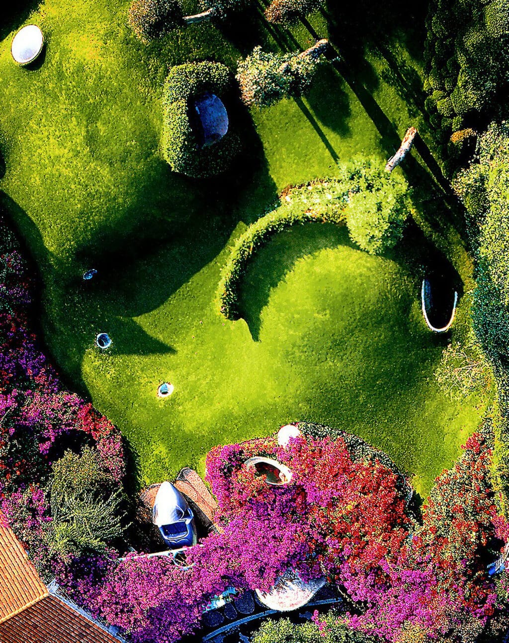An aerial view of a organic house lush green park
