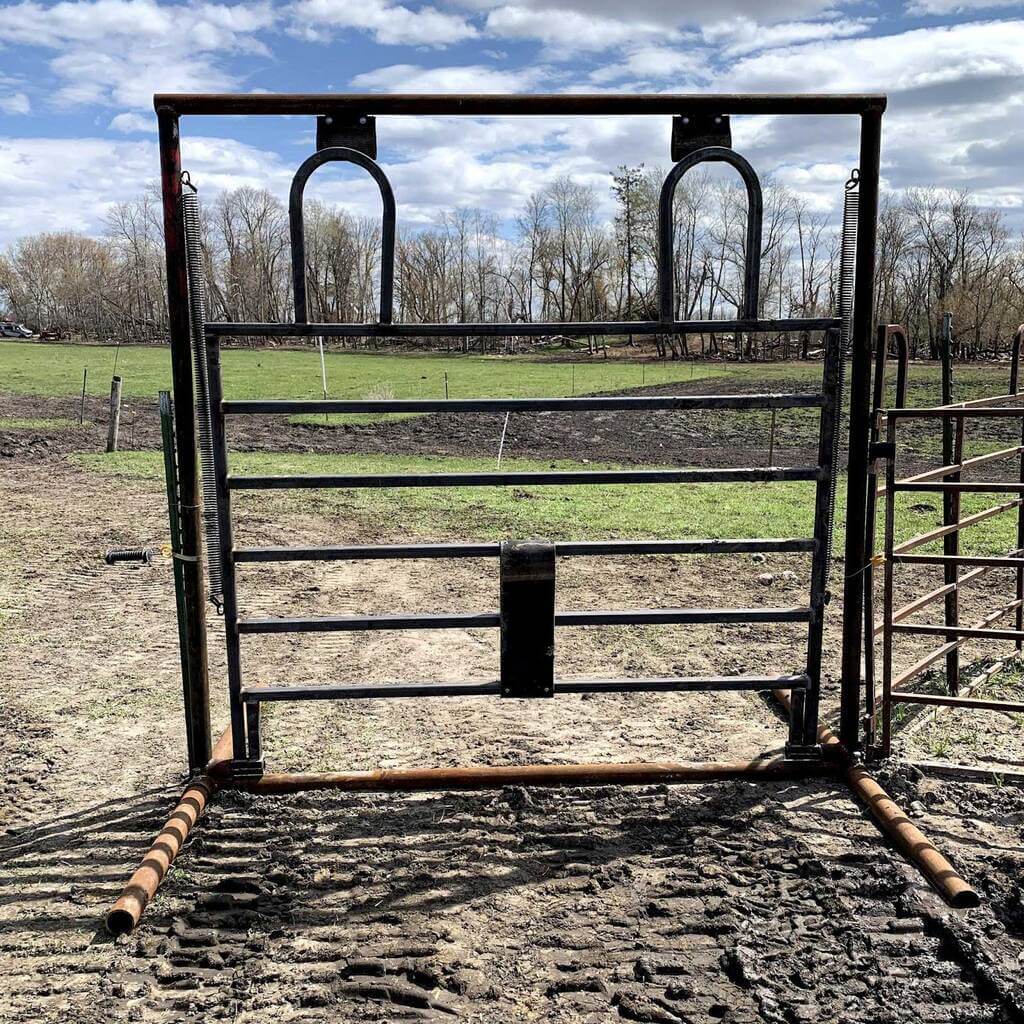 A metal gate in the middle of a field