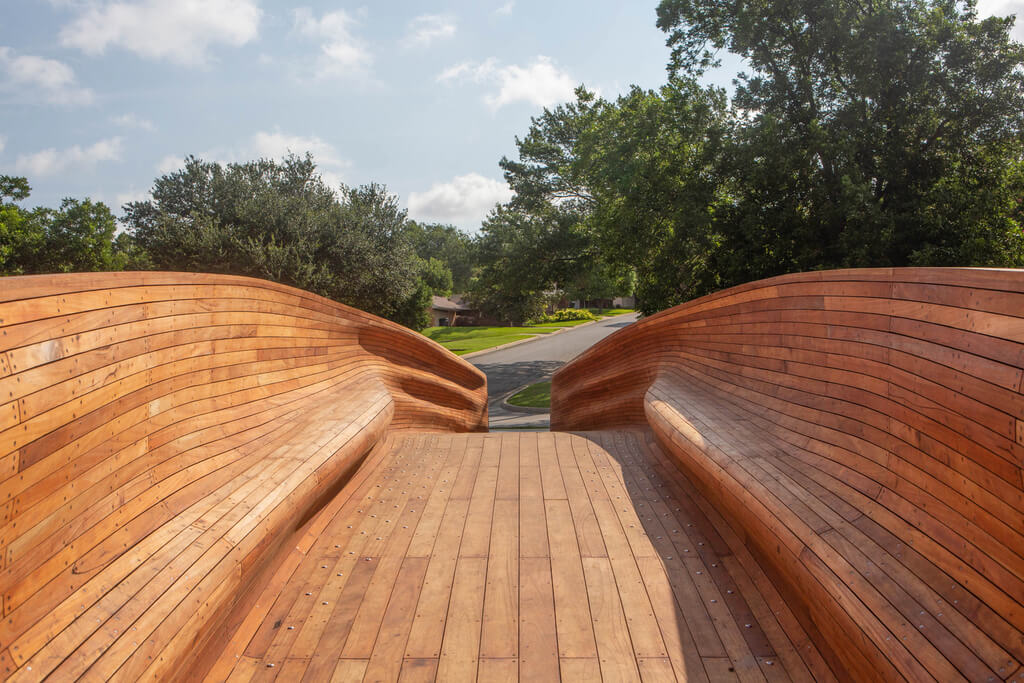 A  drift bridge design sitting on top of a wooden walkway
