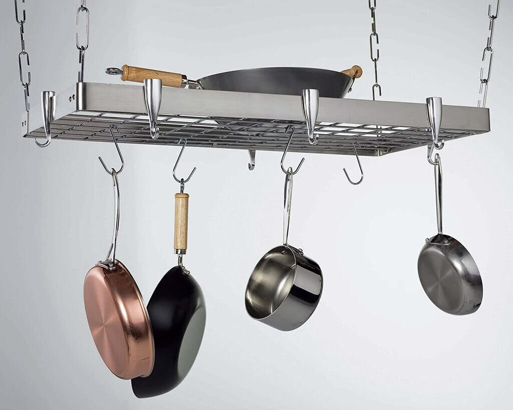 Pots and pans hanging from a metal rack
