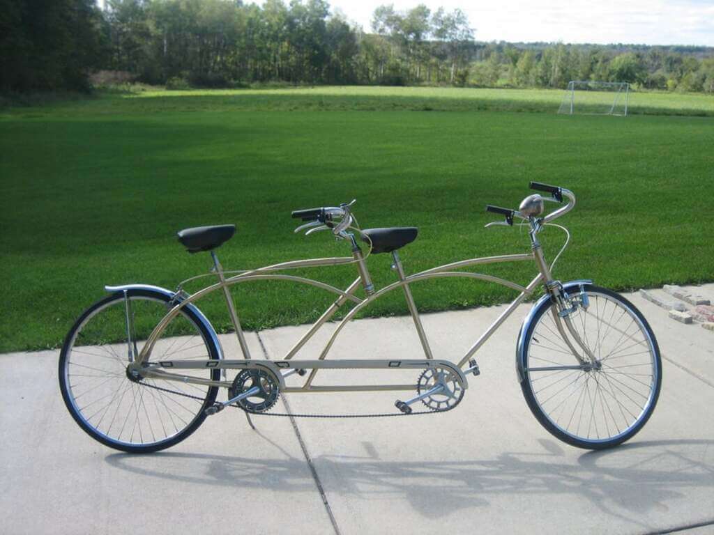 welding projects ideas A bicycle parked on a sidewalk in front of a field
