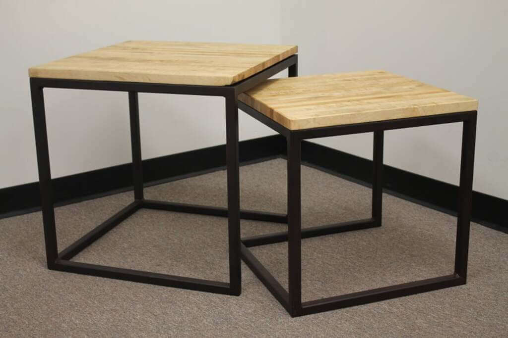 A couple of tables sitting on top of a carpeted floor welding projects ideas 