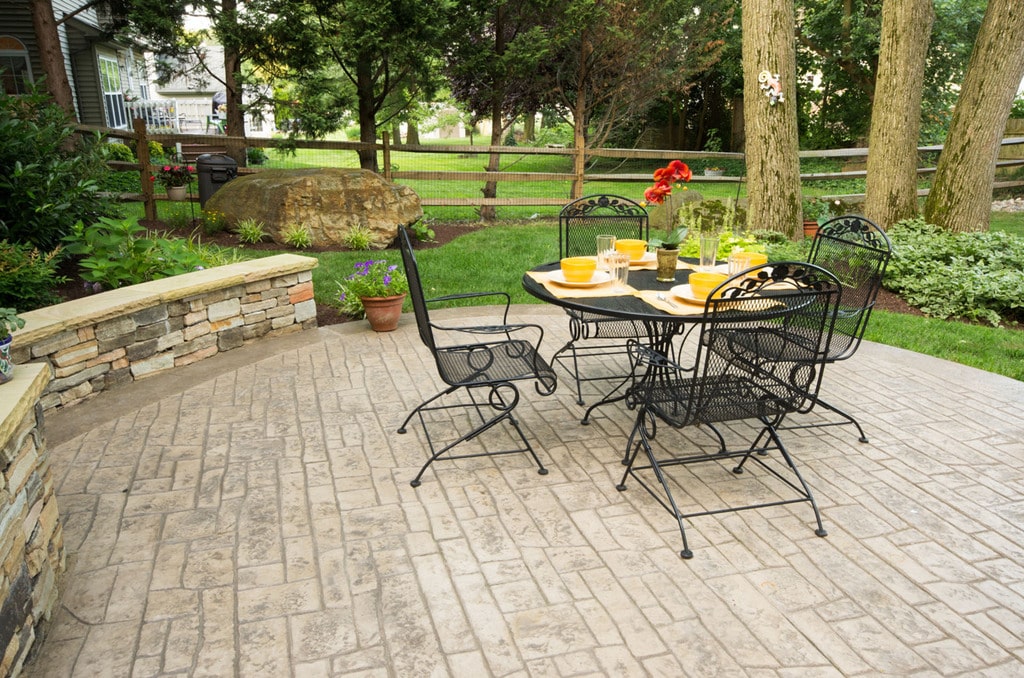 stamped concrete patio with small dinning table