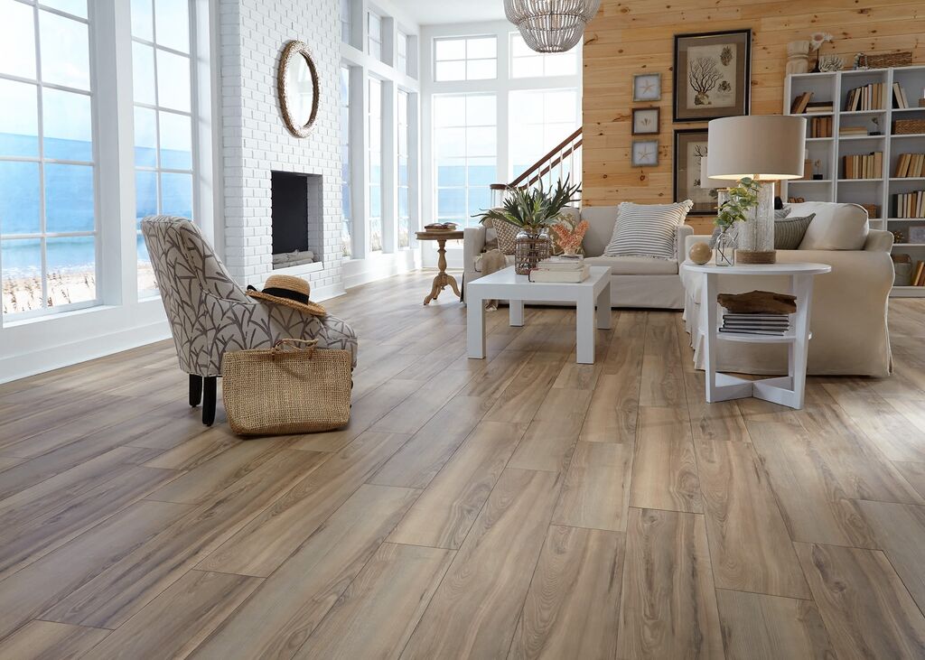 A living room filled with furniture and a large window
