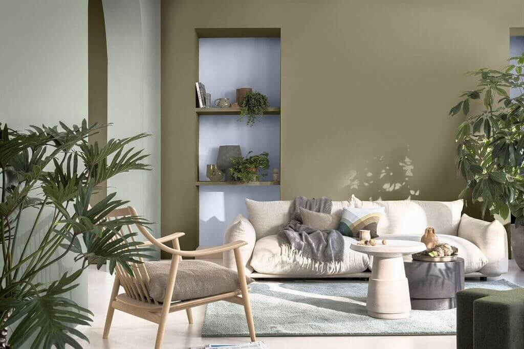 A living room filled with furniture and plants

