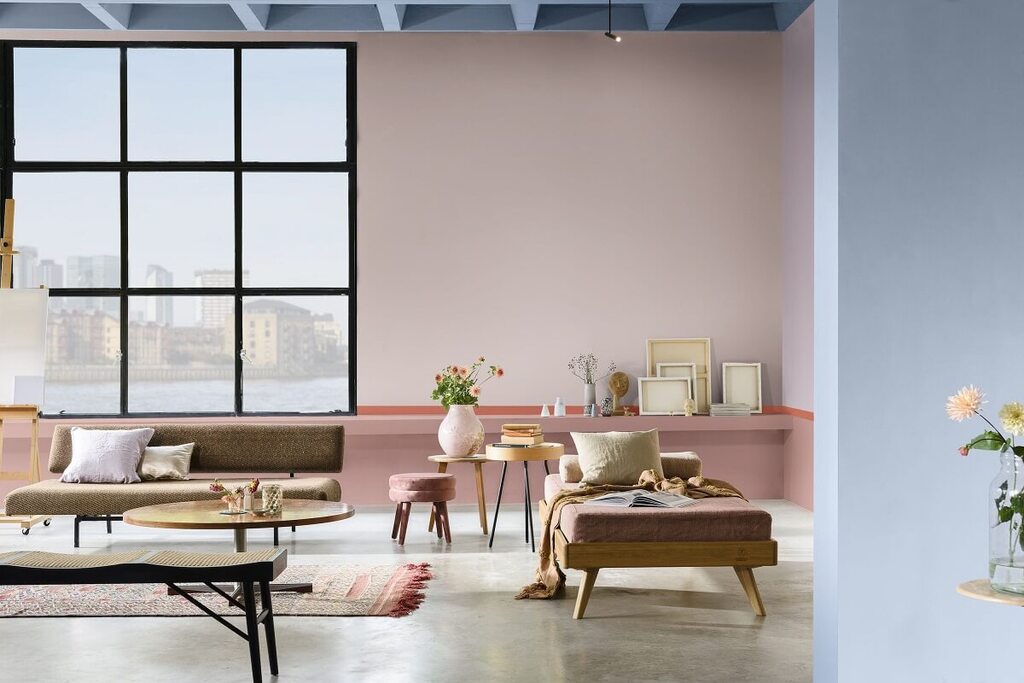 A living room filled with furniture and a large window
