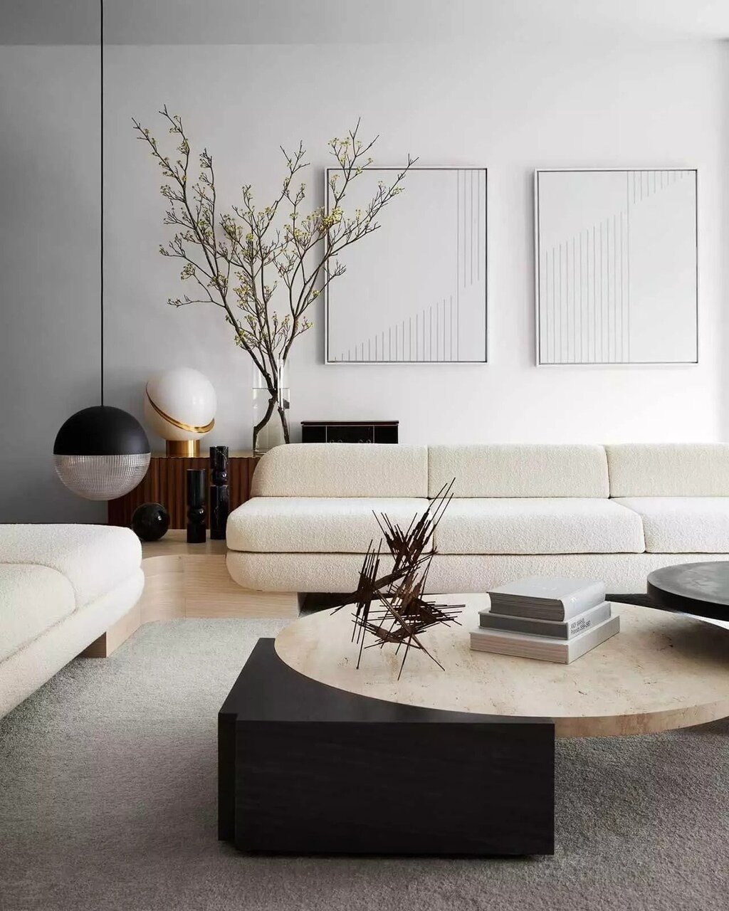 A living room with a white couch and a coffee table
