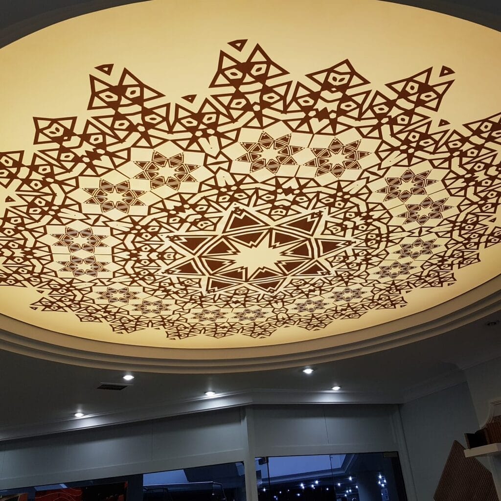 A ceiling with a decorative pattern on it
