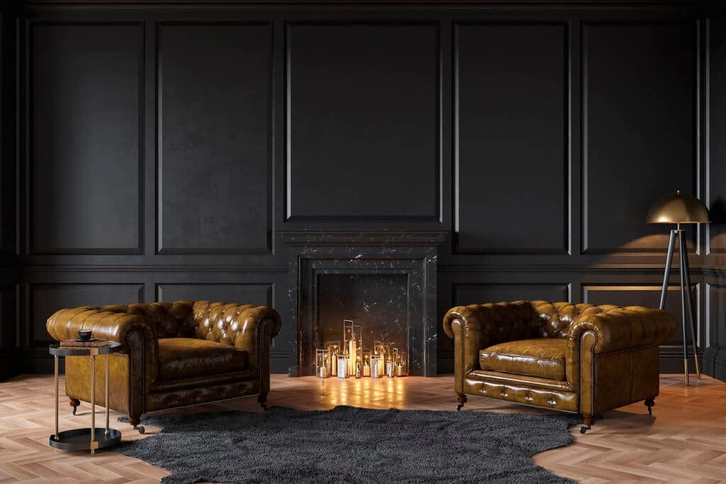 A living room with two leather chairs and a fireplace
