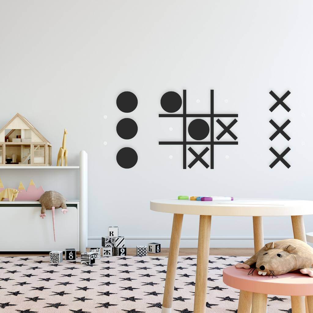 A child's room with black and white wall decals
