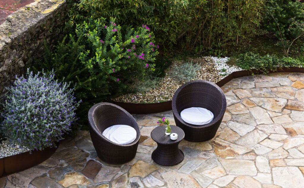 flagstone patio with wooden seat